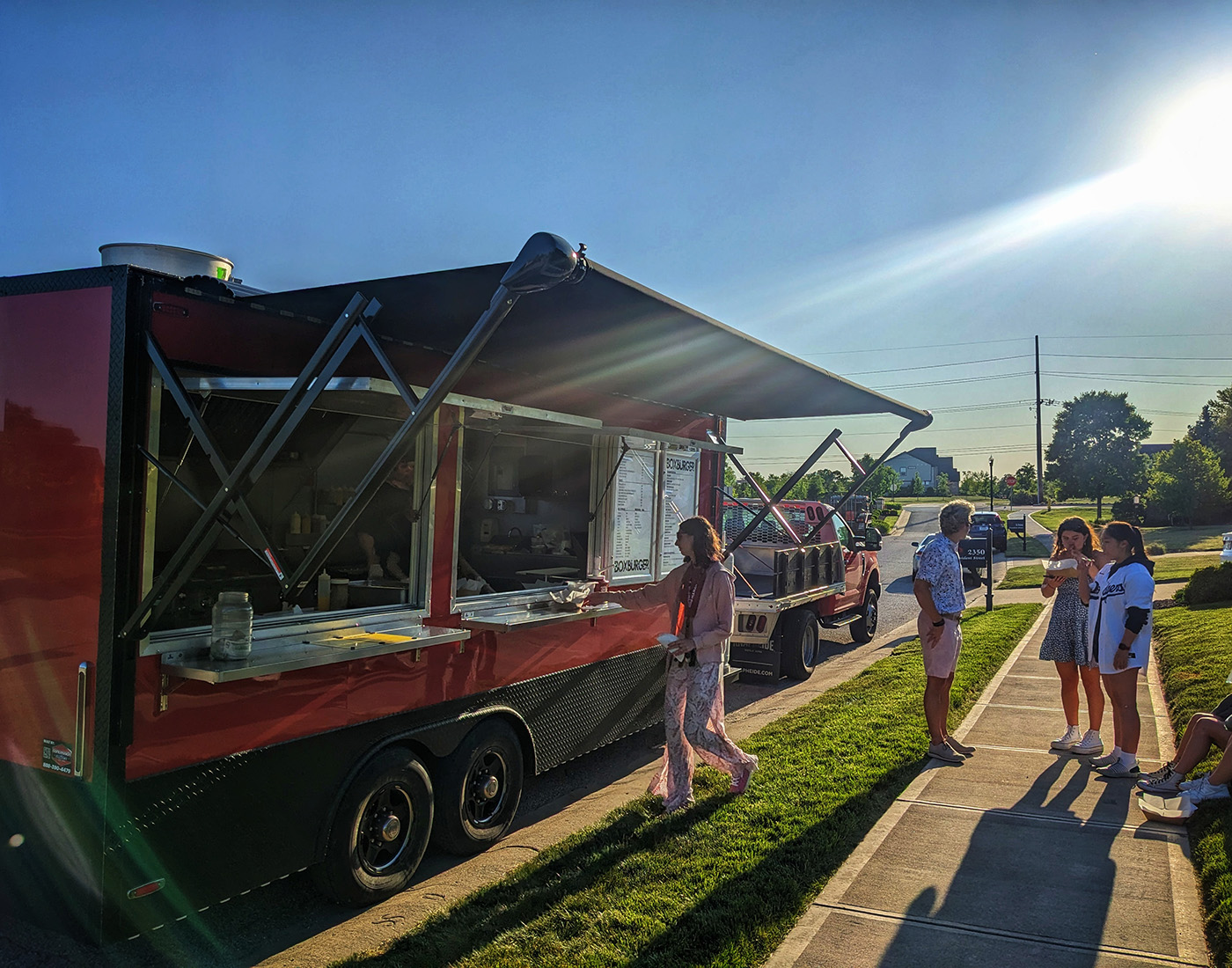 BoxBurger food truck serving a lively event crowd
